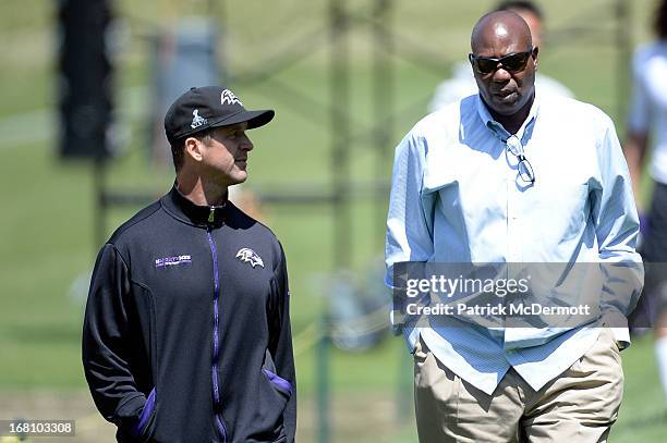 Head coach John Harbaugh of the Baltimore Ravens speaks with general manager Ozzie Newsome after a practice during the Baltimore Ravens rookie camp...