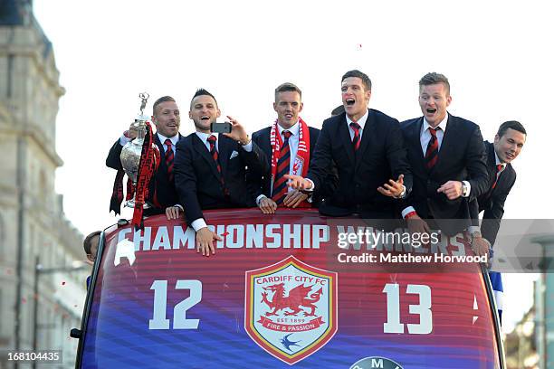 Cardiff City FC players Craig Bellamy, Craig Conway, Craig Noone, Mark Hudson, Aron Gunnarsson and Don Cowie ride in an open top bus through the city...