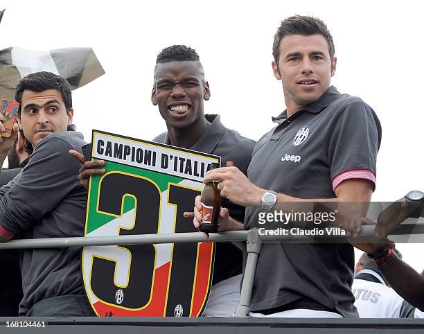 Andrea Barzagli and Paul Pogba of Juventus celebrates at the end of the Serie A match between Juventus and US Citta di Palermo at Juventus Arena on...