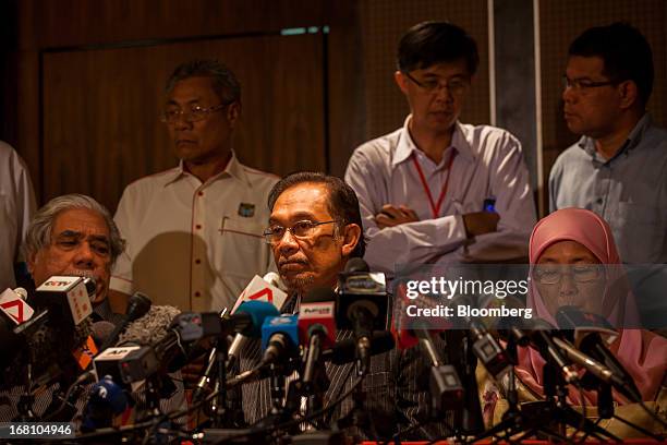 Anwar Ibrahim, Malaysia's opposition leader, listens during a news conference at the One World Hotel in Kuala Lumpur, Malaysia, on Sunday, May 5,...