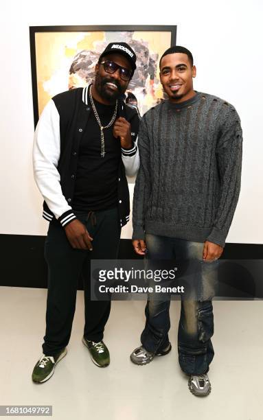 Dereck Chisora and Tyrique Hyde attend the "Radiant Resilience" debut exhibition from Zara Muse at Quantus Gallery Shoreditch on September 21, 2023...