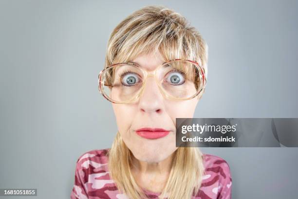 woman with mullet and dumb look on her face - mullet haircut stock pictures, royalty-free photos & images
