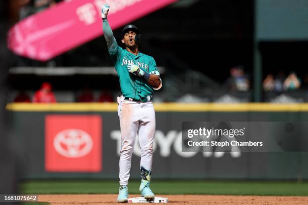 Julio Rodriguez of the Seattle Mariners reacts after his RBI double during the third inning against the Los Angeles Angels at T-Mobile Park on...