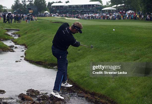 David Lynn of England hits a shot on the 18th hole in a playoff against Derek Ernst during the final round of the Wells Fargo Championship at Quail...