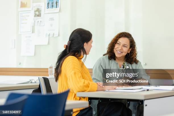 tutoring student discusses success with tutor - tutor stock pictures, royalty-free photos & images