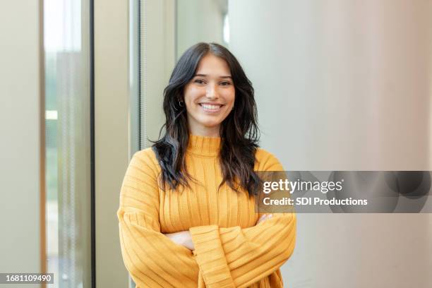 portrait of beautiful, confident young adult female university student - teachers white university stock pictures, royalty-free photos & images