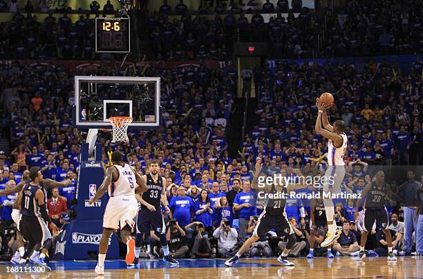 Kevin Durant of the Oklahoma City Thunder makes a three-point shot with 12.6 seconds left against the Memphis Grizzlies during Game One of the...