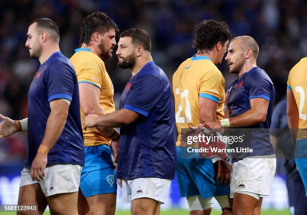 Gabin Villiere of France shakes hands with Guillermo Pujadas of Uruguay at full-time followingthe Rugby World Cup France 2023 match between France...