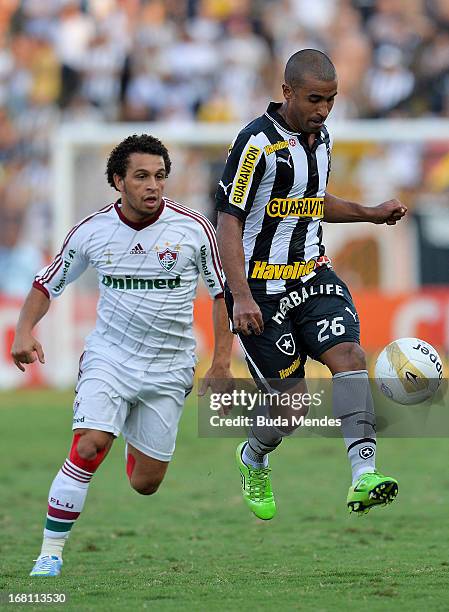 Wellington Nem of Fluminense fights for the ball with Julio Cesar of Botafogo during a match between Fluminense and Botafogo as part of Rio State...