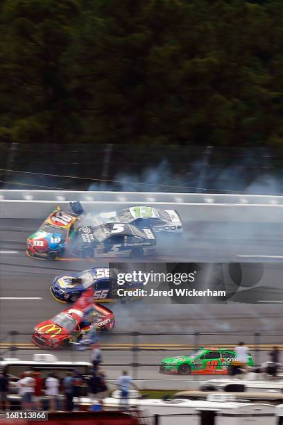 Kyle Busch, driver of the M&M's Toyota, Casey Mears, driver of the GEICO Ford, Michael Waltrip, driver of the Aaron's Dream Machine / Alabama...