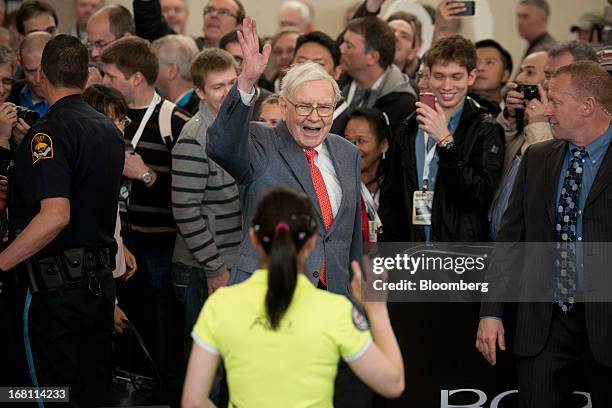 Warren Buffett, chairman and chief executive officer of Berkshire Hathaway, Inc., greets Ariel Hsing, a U.S. Table tennis player, foreground in...