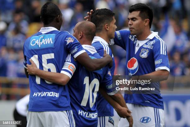 Players of Millonarios celebrate a goal against Patriotas during a match between Millonarios and Patriotas as part of Liga Postobon 2013 at the...