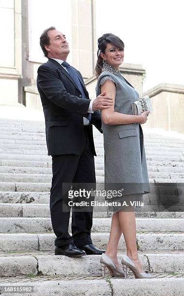 Actress Maria Grazia Cucinotta and husband Giulio Violati arrive at the Valeria Marini And Giovanni Cottone wedding at Ara Coeli on May 5, 2013 in...