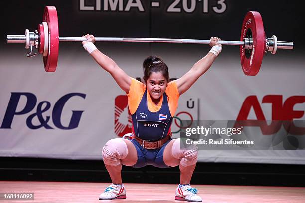 Sopita Tanasan of Thailand A competes in the Women's 53kg snatch during day two of the 2013 Junior Weightlifting World Championship at Maria Angola...