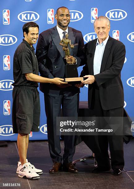 Erik Spoelstra, LeBron James and Pat Riley attend the LeBron James press confernece to announce his 4th NBA MVP Award at American Airlines Arena on...