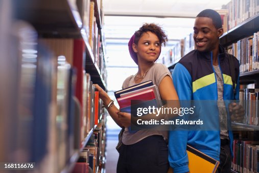 Talking In The Library Students Talking In Library High-Res Stock Photo - Getty Images