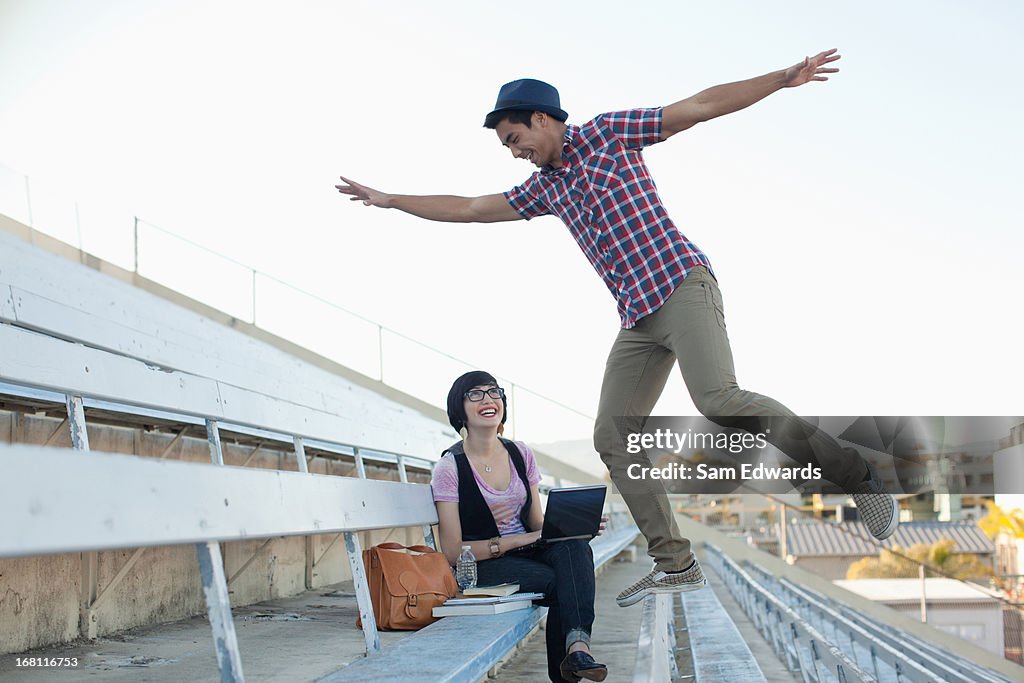 Students relaxing on bleachers