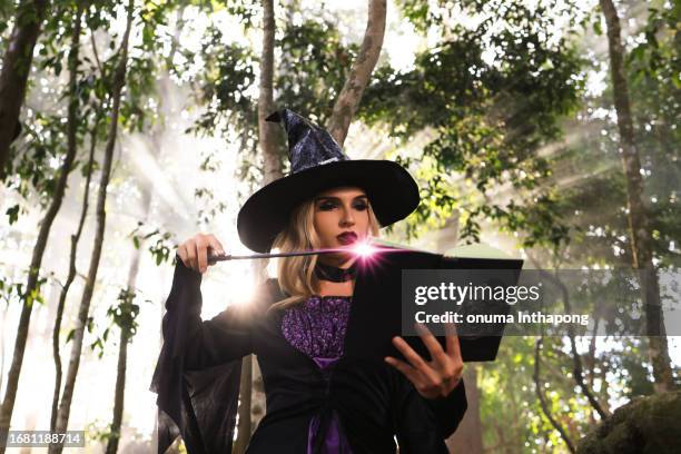 the witch cast a spell, halloween concept - wizard wand stock pictures, royalty-free photos & images