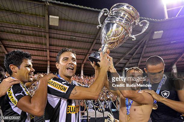 Players of Botafogo celebrate after winning the Rio State Championship 2013 at Raulino de Oliveira Stadium on May 05, 2013 in Volta Redonda, Brazil.