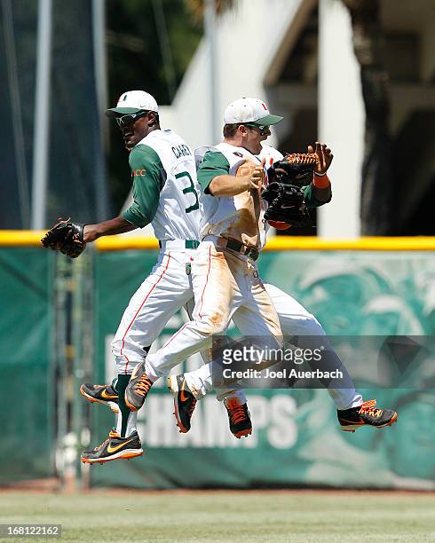 The Miami Hurricanes celebrate their victory against the St John's Red Storm on May 5, 2013 at Alex Rodriguez Park at Mark Light Field in Coral...