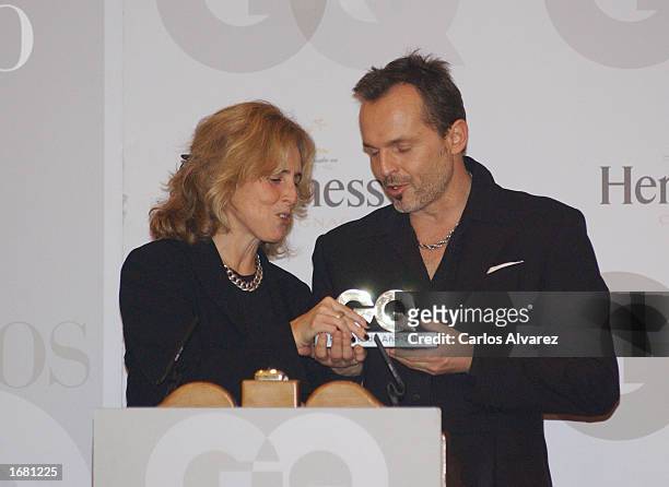 Spanish singer Miguel Bose receives his award from spanish journalist Mercedes Mila during "GQ Magazine Men of Year 2002 Awards" December 10, 2002 at...