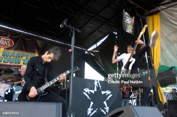 American rock musicians Justin Sane and Chris Barker , both of the group Anti-Flag, on stage at the First Midwest Bank Amphitheatre during the 2006...