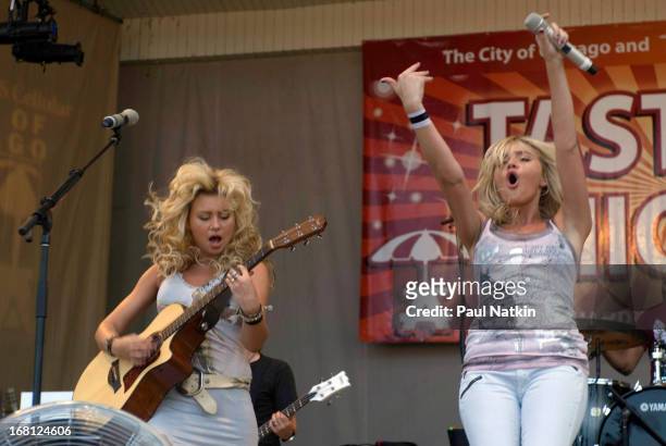 American sibling pop musicians and actresses Alyson and Amanda Michalka, who perform as Aly and AJ , play on the Petrillo Band Shell in Grant Park...