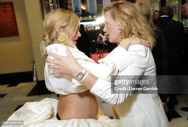 Sienna Miller and Kate Winslet attend Vogue World: London 2023 at The Theatre Royal Drury Lane on September 14, 2023 in London, England.