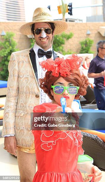 Actor Voki Kalfayan as his character The Gazillionaire and entertainer Penny Pibbets from the show "Absinthe" arrive at Sapphire Pool & Day Club...