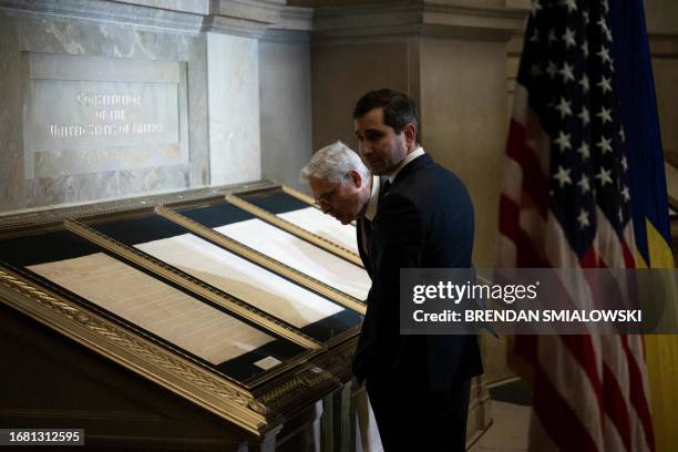 Attorney General Merrick Garland looks at replicas of the US founding documents while waiting for Ukrainian President Volodymyr Zelensky to speak at...