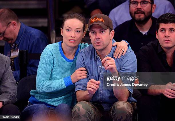 Olivia Wilde and Jason Sudeikis attend the New York Knicks vs Indiana Pacers NBA playoff game at Madison Square Garden on May 5, 2013 in New York...