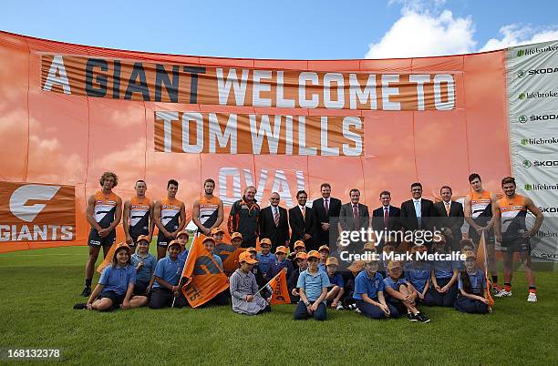 Andrew Demetriou, NSW Minister for Sport Graham Annesley, GWS Giants players and officials and local school children pose during a GWS Giants AFL...