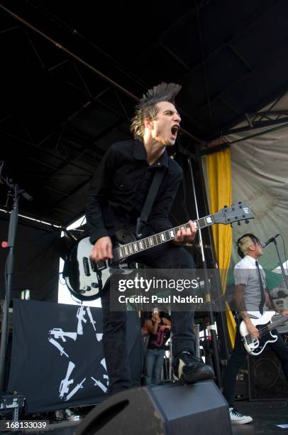 American rock musician Justin Sane, of the group Anti-Flag, performs on stage at the First Midwest Bank Amphitheatre during the 2006 Vans Warped...