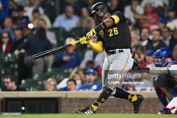 Miguel Andujar of the Pittsburgh Pirates hits an RBI single in the fifth inning against the Chicago Cubs at Wrigley Field on September 21, 2023 in...