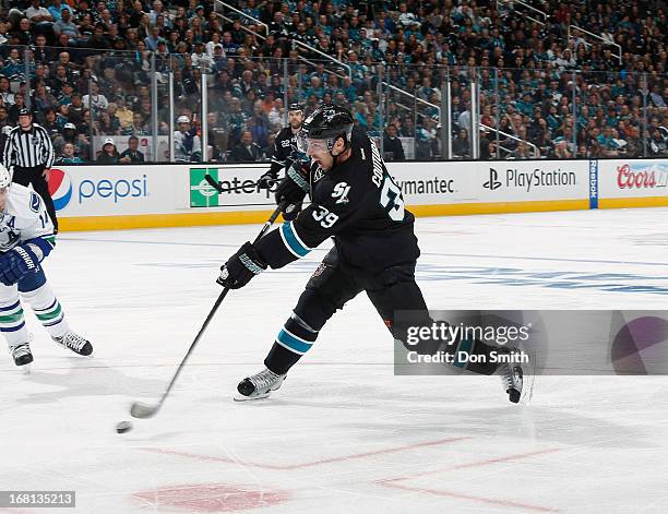 Logan Couture of the San Jose Sharks scores a goal against the Vancouver Canucks in Game One of the Western Conference Quarterfinals during the 2013...