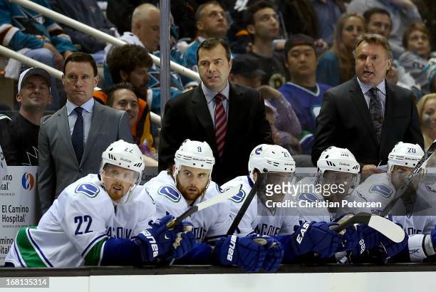 Head coach Alain Vigneault of the Vancouver Canucks watches from the bench in Game Three of the Western Conference Quarterfinals against the San Jose...