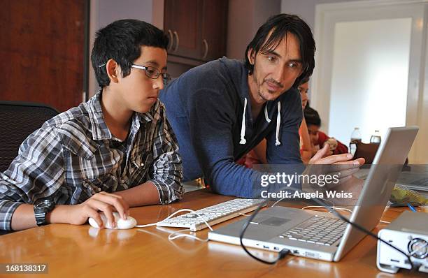 Editor Ulf Buddensieck teaches a student during the Rohde & Schwarz with Hollywood HEART Filmmaking Workshop on May 5, 2013 in Studio City,...