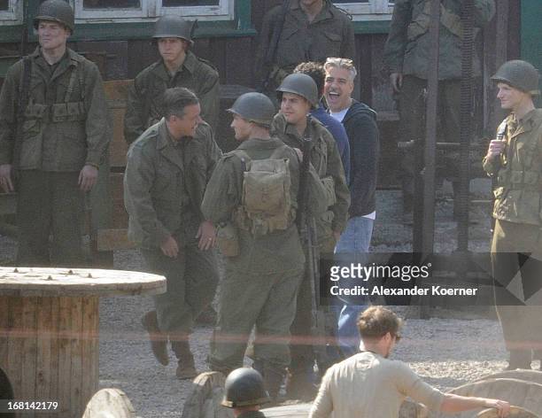 Actor and director George Clooney is seen cheering together with Matt Damon on George Clooney's 51st birthday at the set of the film "The Monuments...