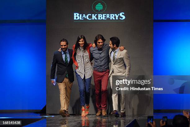 Indian American musician Karsh Kale, Bollywood singer Anushka Manchanda, actor Arjun Rampal and Ayushmann Khurrana walk the ramp during the...