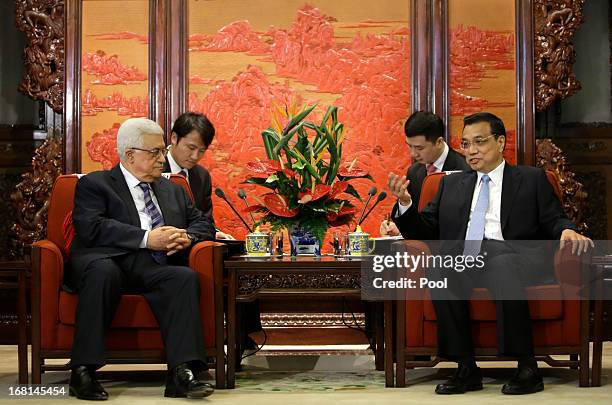 China's Premier Li Keqiang talks with Palestinian President Mahmoud Abbas during a meeting at the Zhongnanhai compound on May 6, 2013 in Beijing,...