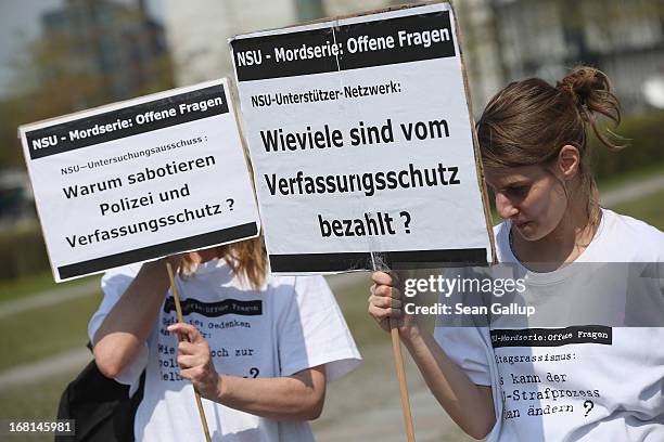 Demonstrators protesting against right-wing violence, including two with signs that read: "NSU Investigation Commission: Why Are Police and the...