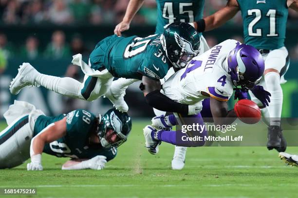 Brandon Powell of the Minnesota Vikings fumbles the ball as he is tackled by Justin Evans of the Philadelphia Eagles on a punt return during the...