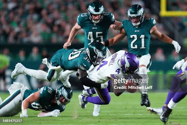 Brandon Powell of the Minnesota Vikings fumbles the ball as he is tackled by Justin Evans of the Philadelphia Eagles on a punt return during the...