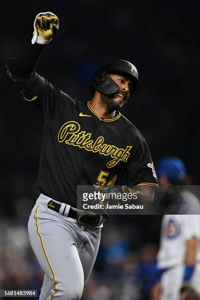 Joshua Palacios of the Pittsburgh Pirates celebrates as he rounds the bases after hitting a three-run pinch hit home run in the ninth inning against...