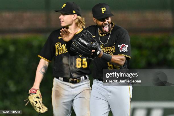 Joshua Palacios of the Pittsburgh Pirates celebrates with Jack Suwinski after the Pirates defeated the Chicago Cubs 8-6 at Wrigley Field on September...