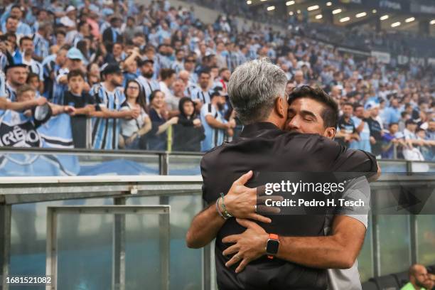 Renato Portaluppi head coach of Gremio hugs Abel Ferreira head coach of Palmeiras before the match between Gremio and Palmeiras as part of...