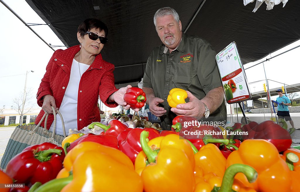 Customer Buying Bell Peppers At Farmer's Market