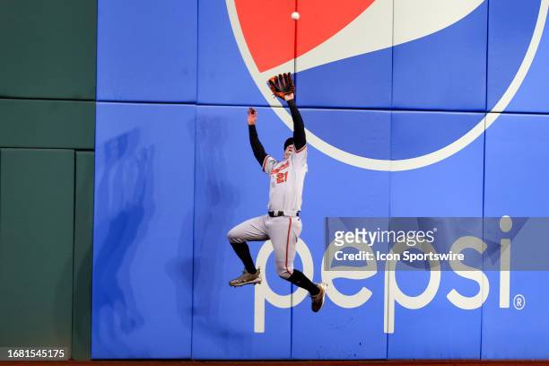 Baltimore Orioles left fielder Austin Hays makes a leaping catch at the wall for an out during the first inning of the Major League Baseball game...