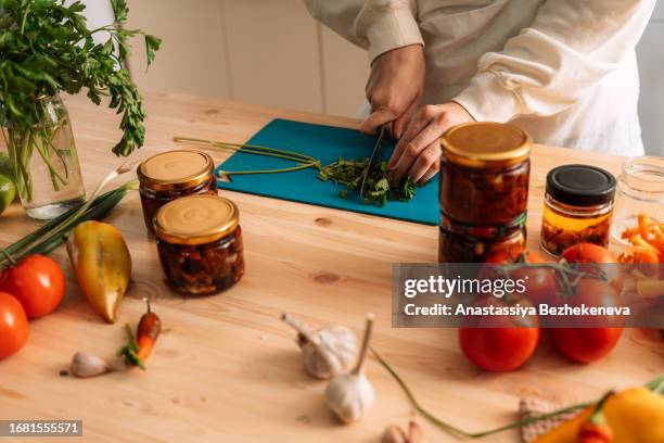 woman chops parsley for preparing vegetables - i was turning into a vegetable stock pictures, royalty-free photos & images