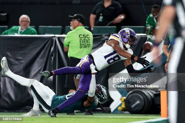 Justin Jefferson of the Minnesota Vikings fumbles the ball over the pylon for a touchback as he is tackled by Terrell Edmunds of the Philadelphia...